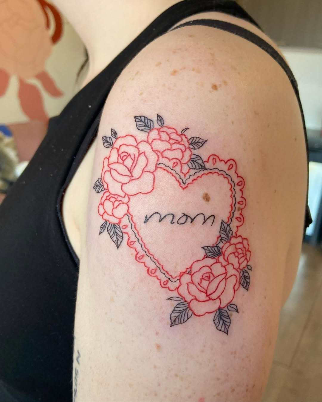 Heartfelt floral tattoo tribute to mothers Tattoo Design