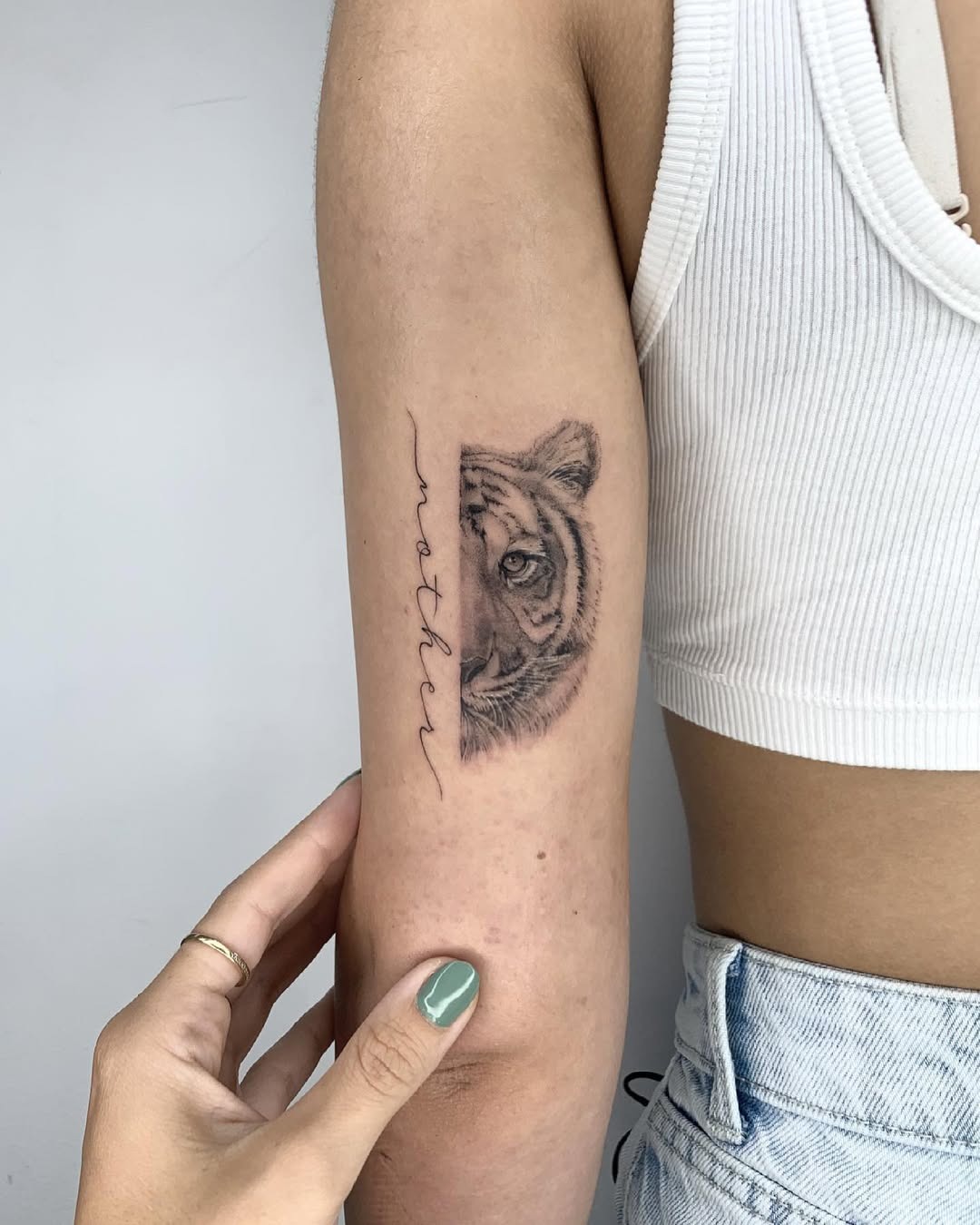 Stunning tattoo of a tiger with 'mother' script Tattoo Design