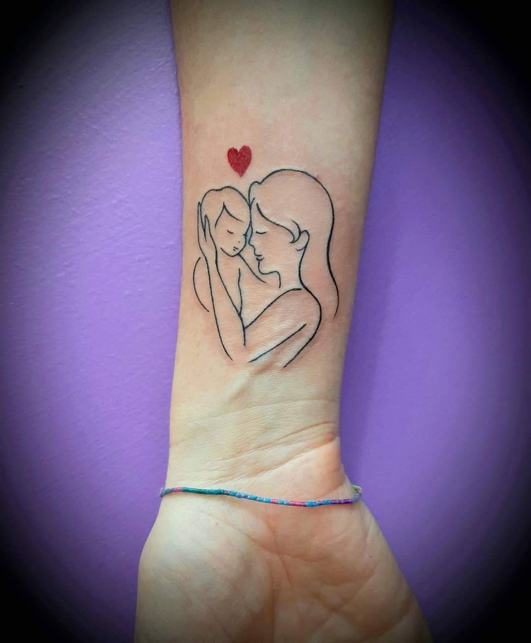 Tender mother-child tattoo with a heart. Tattoo Design