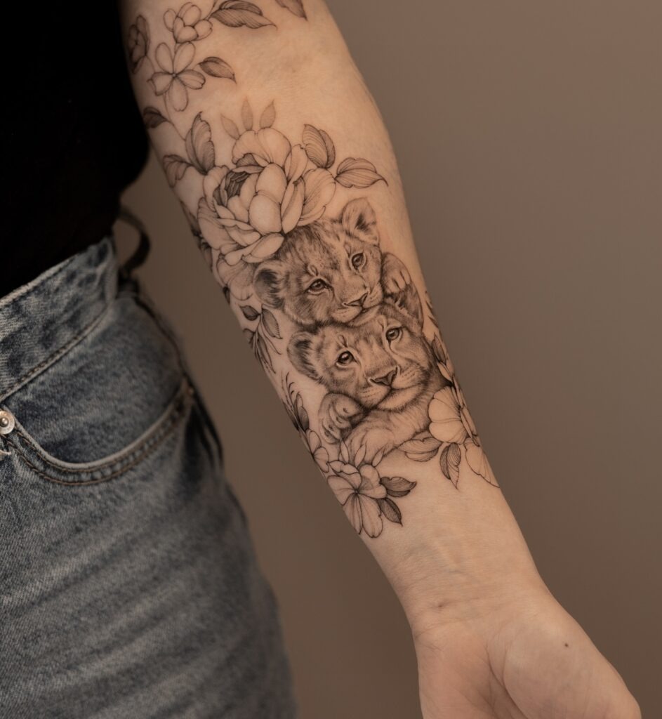 Lion Cubs with Floral Surround Tattoo Tattoo Design