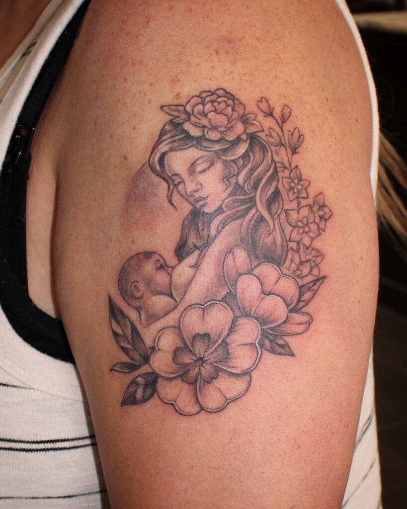 Mother Breastfeeding Surrounded by Flowers Tattoo Tattoo Design