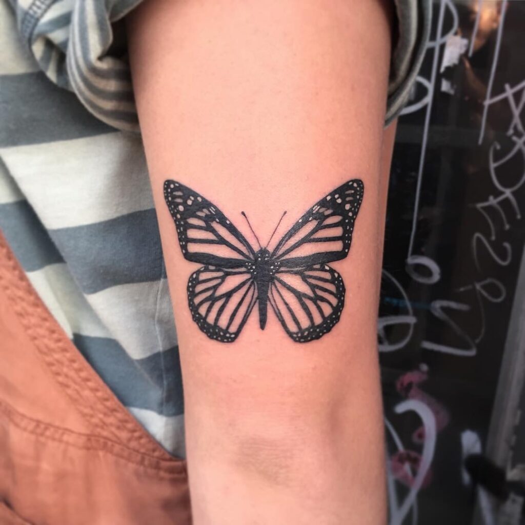 Black Ink Monarch Butterfly Tattoo on Arm Tattoo Design