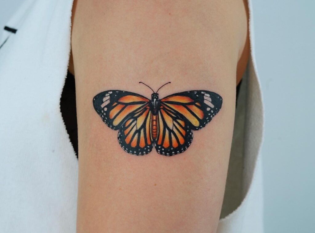 Color Monarch Butterfly Tattoo on Upper Arm Tattoo Design