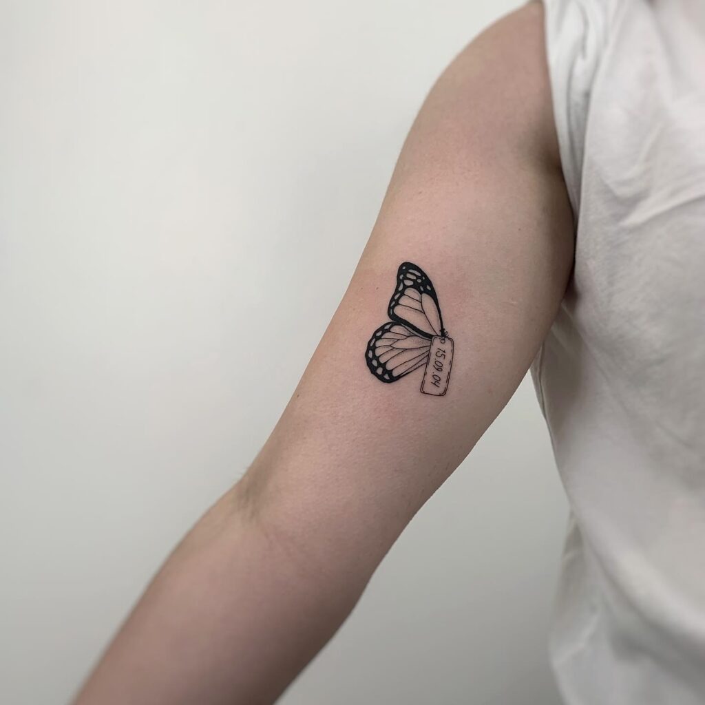 Monarch Butterfly Wing Tattoo with Date Tag Tattoo Design