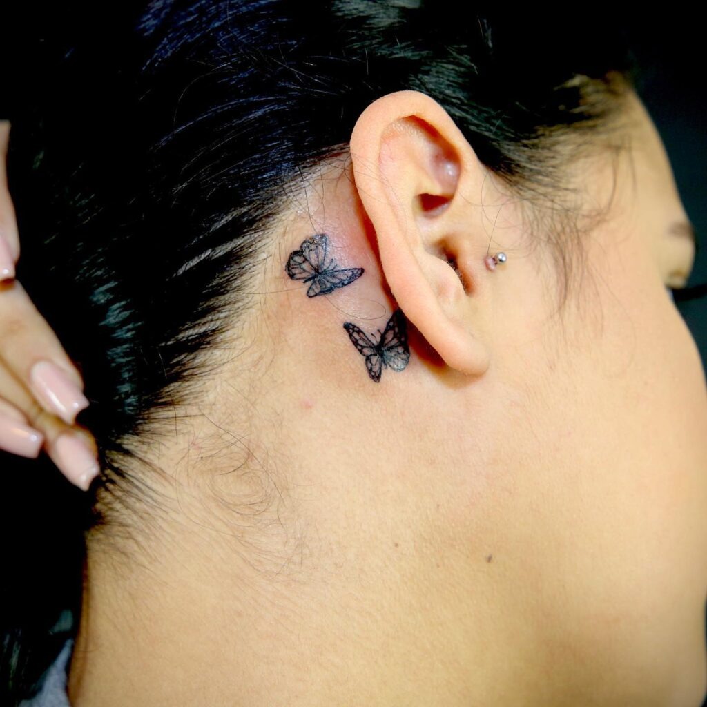 Two Small Monarch Butterfly Tattoos Behind Ear Tattoo Design