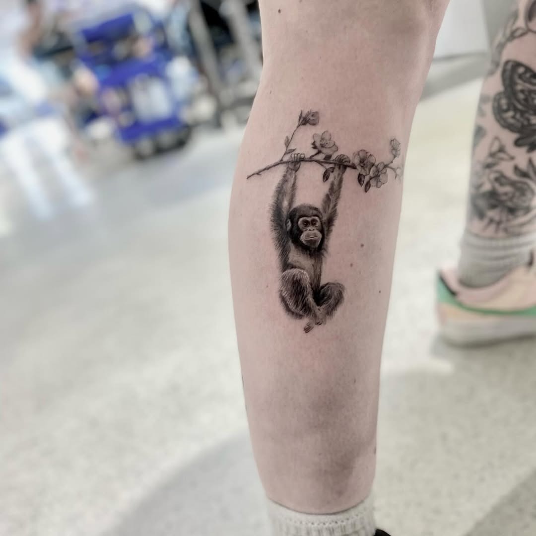 Charming Monkey Tattoo with Branch Detail Tattoo Design