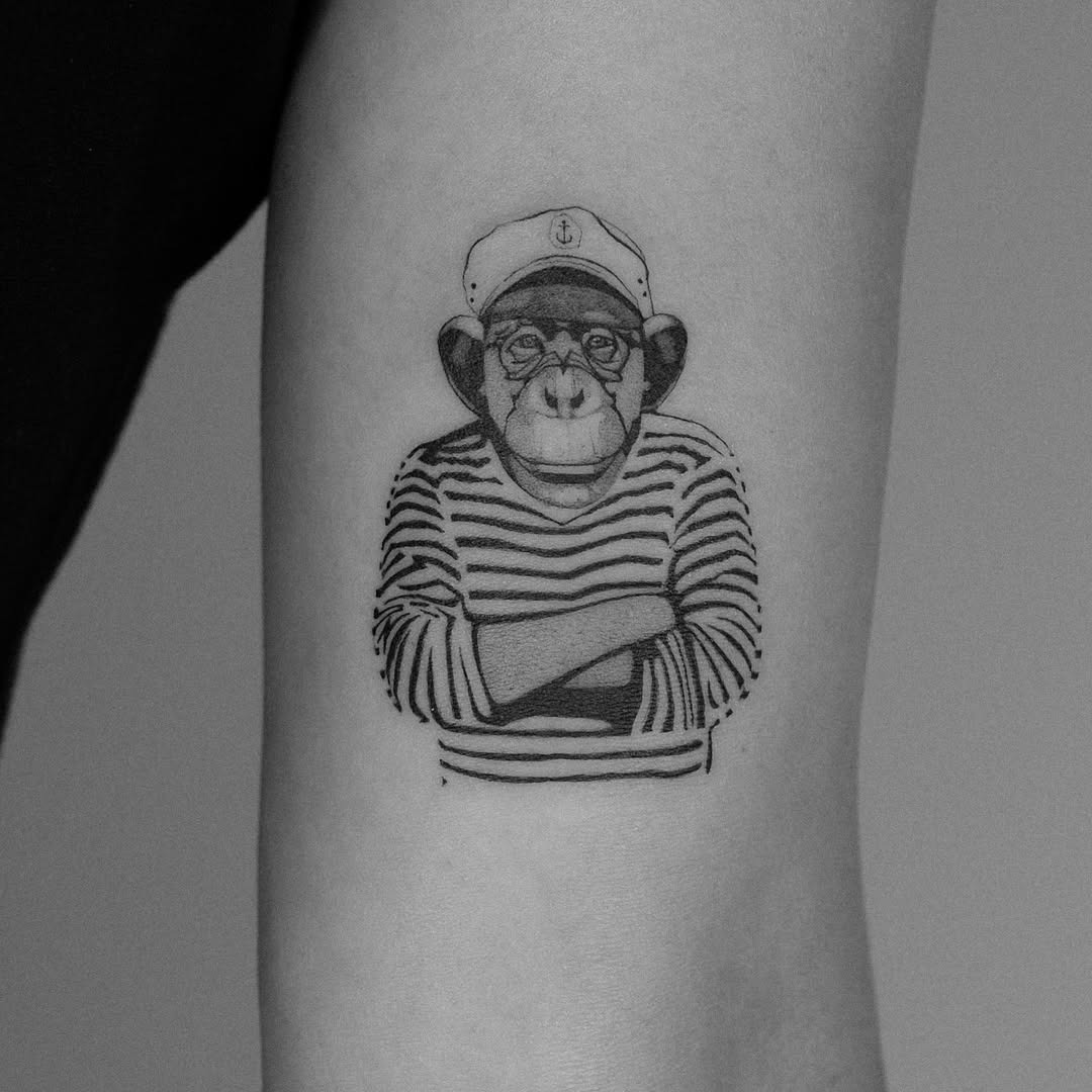 Charming Monkey Tattoo with Stripes and Glasses Tattoo Design