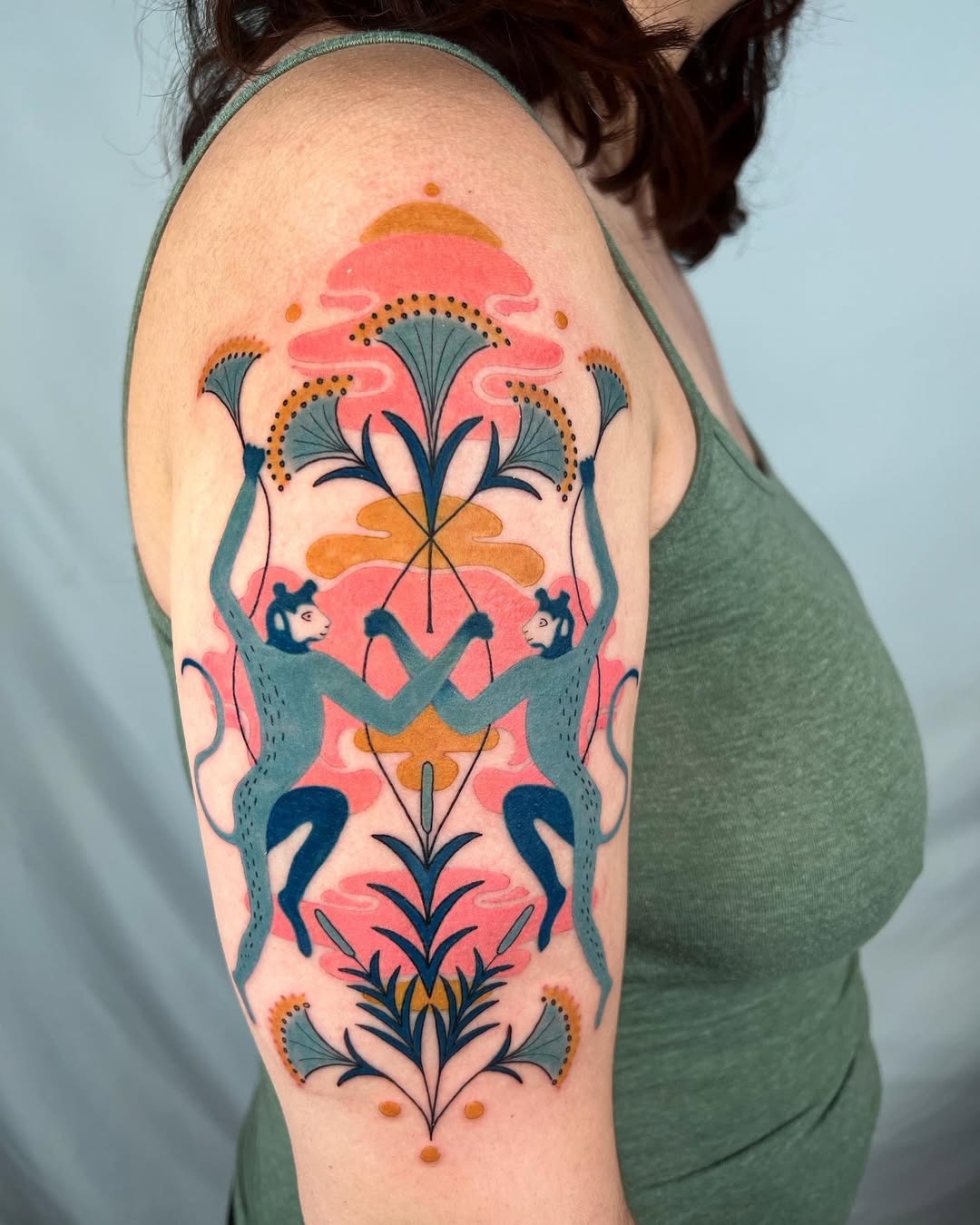Colorful monkey tattoo with floral accents Tattoo Design