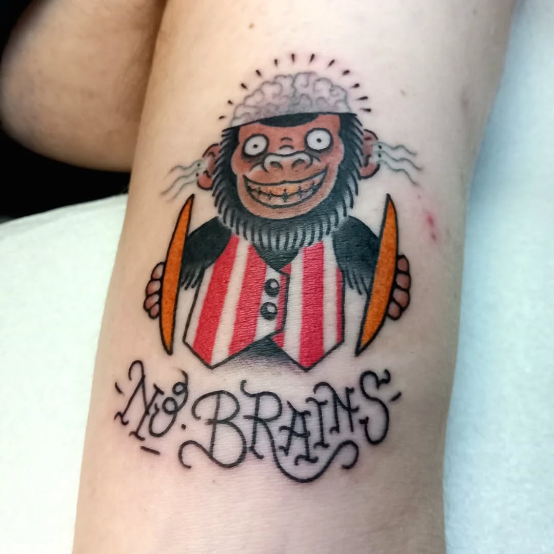 Playful monkey tattoo with a humorous twist Tattoo Design