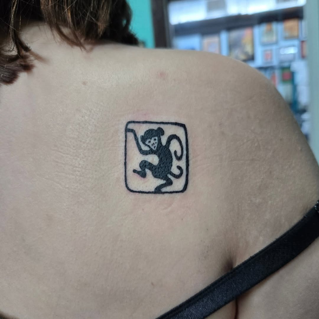 Unique playful monkey tattoo design on shoulder Tattoo Design