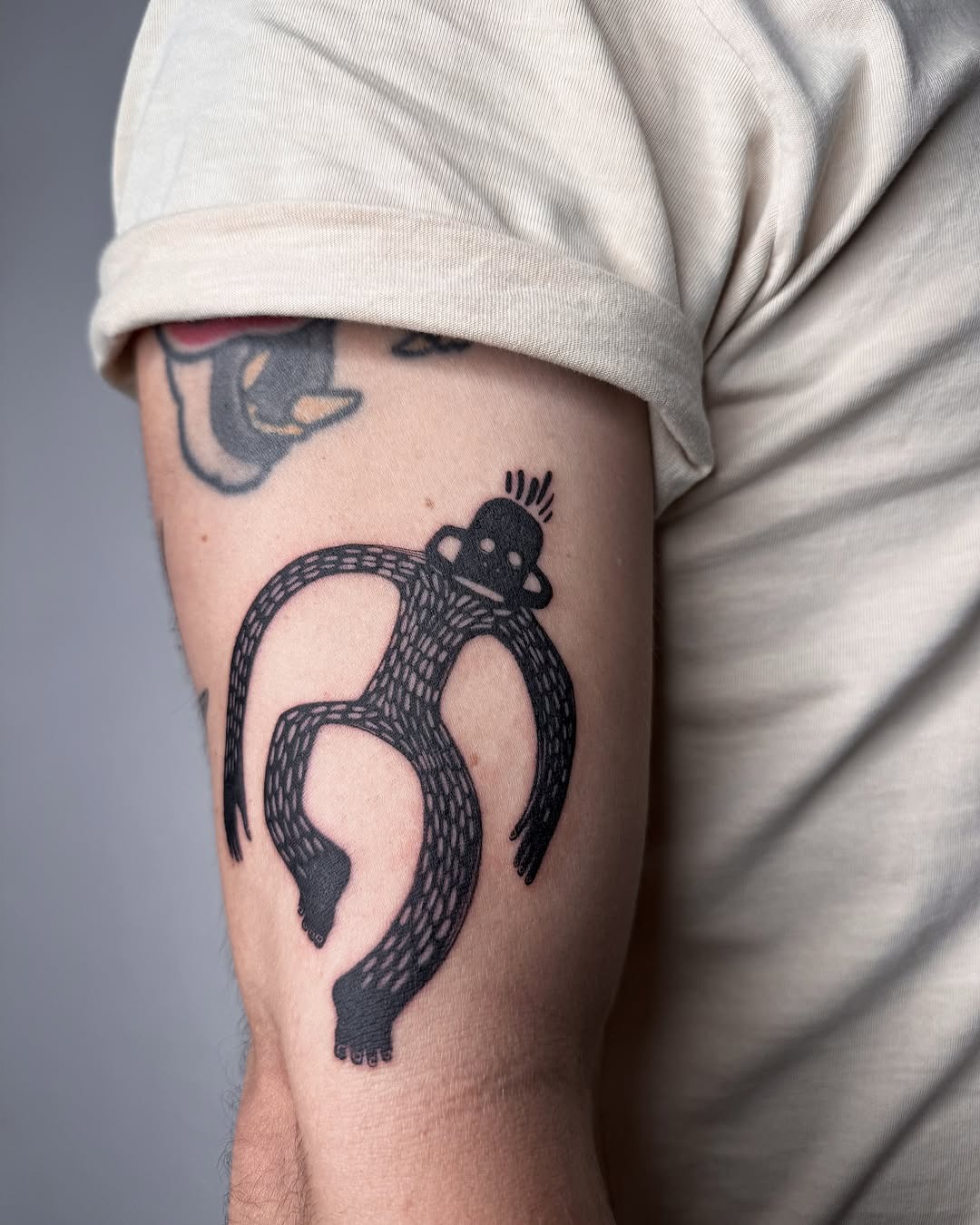 Whimsical monkey tattoo with unique patterns Tattoo Design