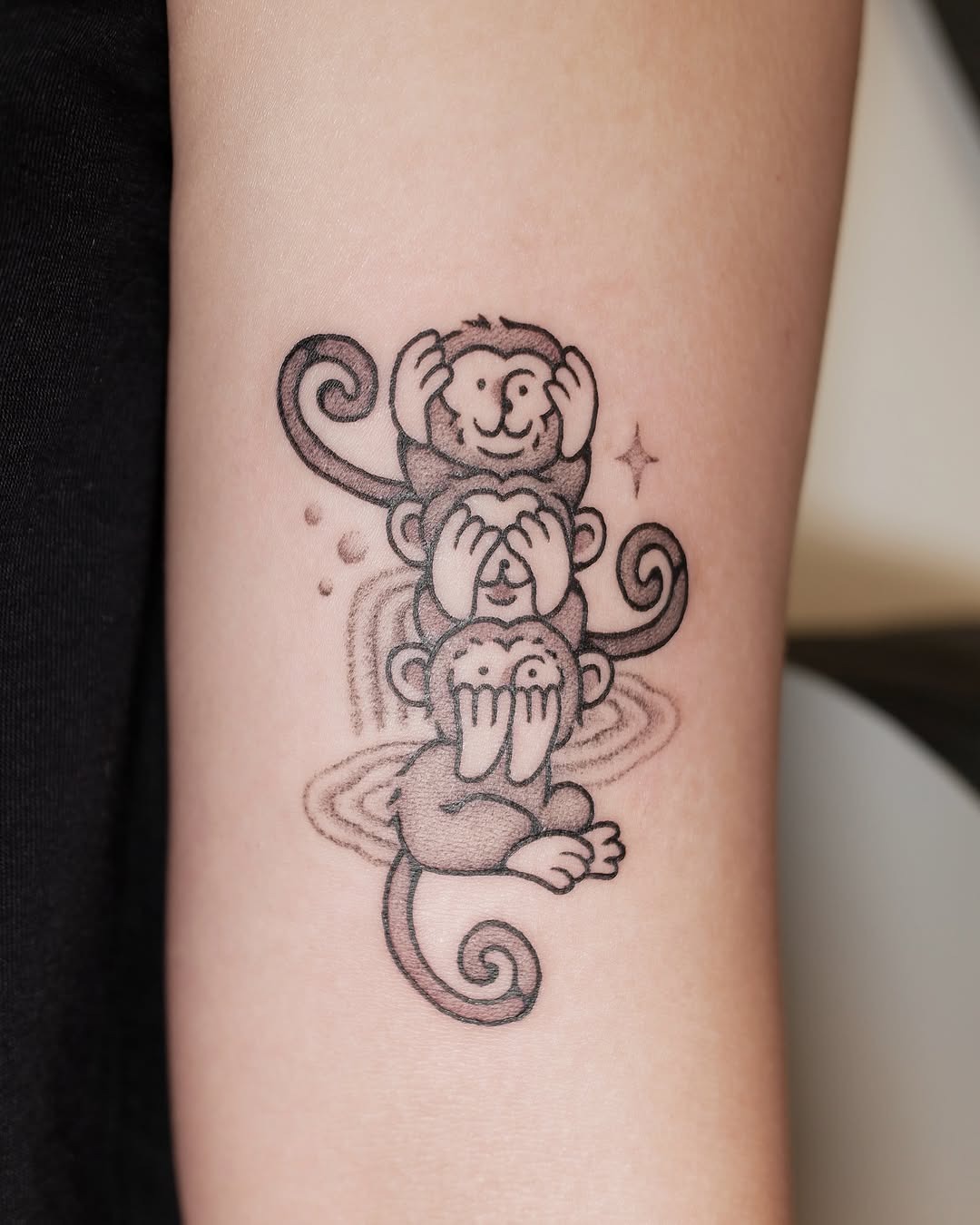 Whimsical Three Monkeys Tattoo in Black Ink Tattoo Design