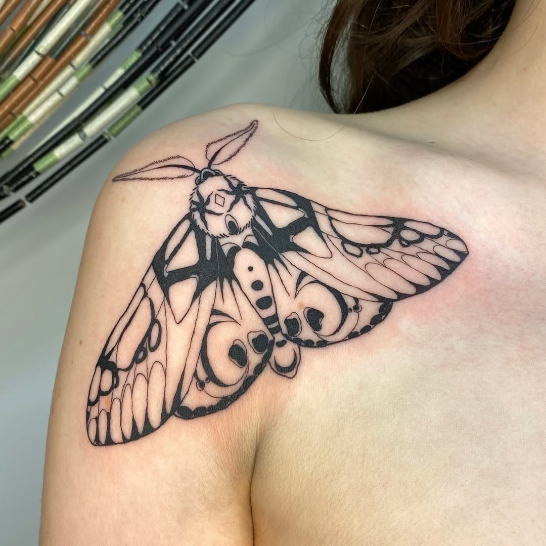 Elegant black and white moth shoulder tattoo Tattoo Design