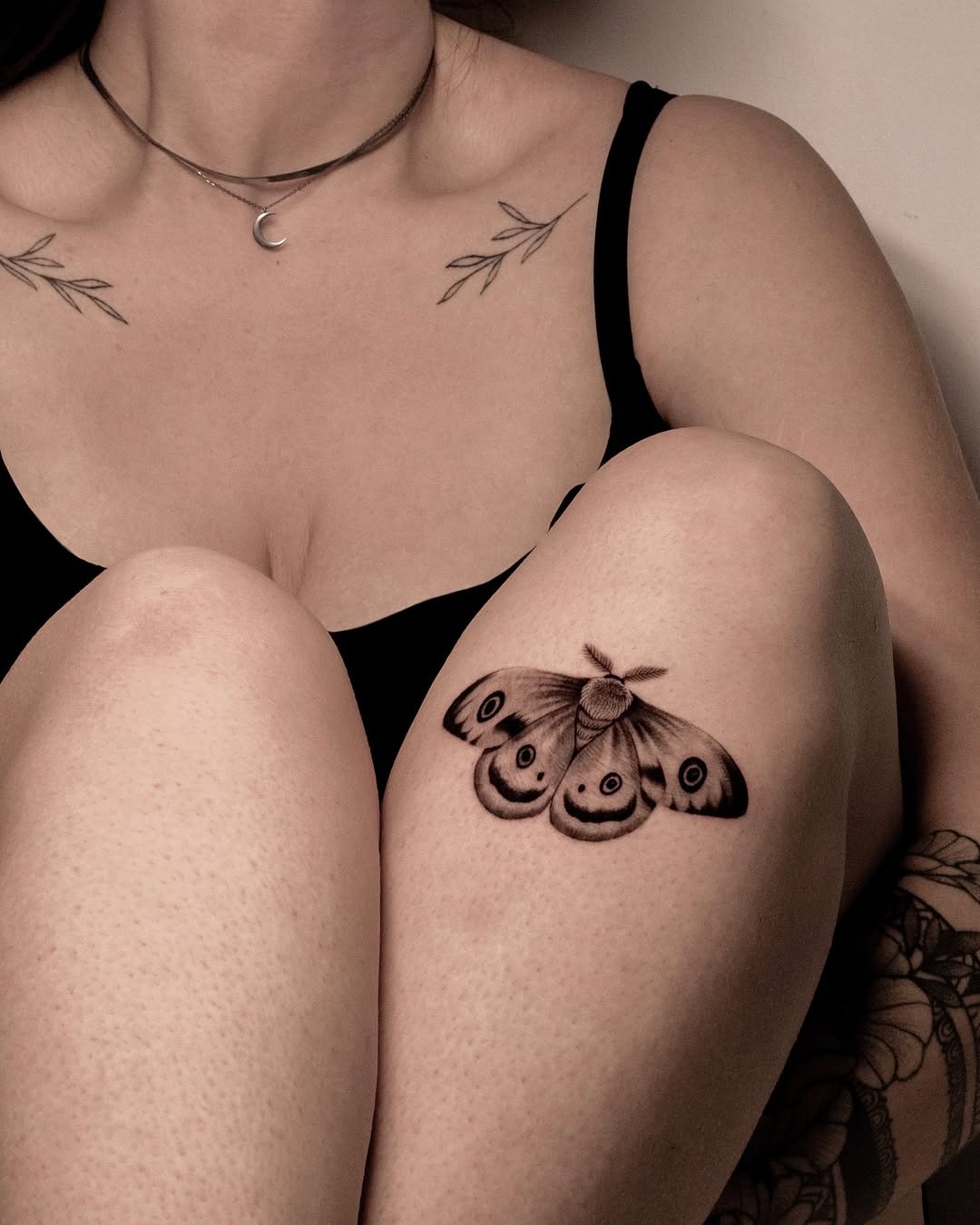 Elegant moth tattoo graces a knee area Tattoo Design