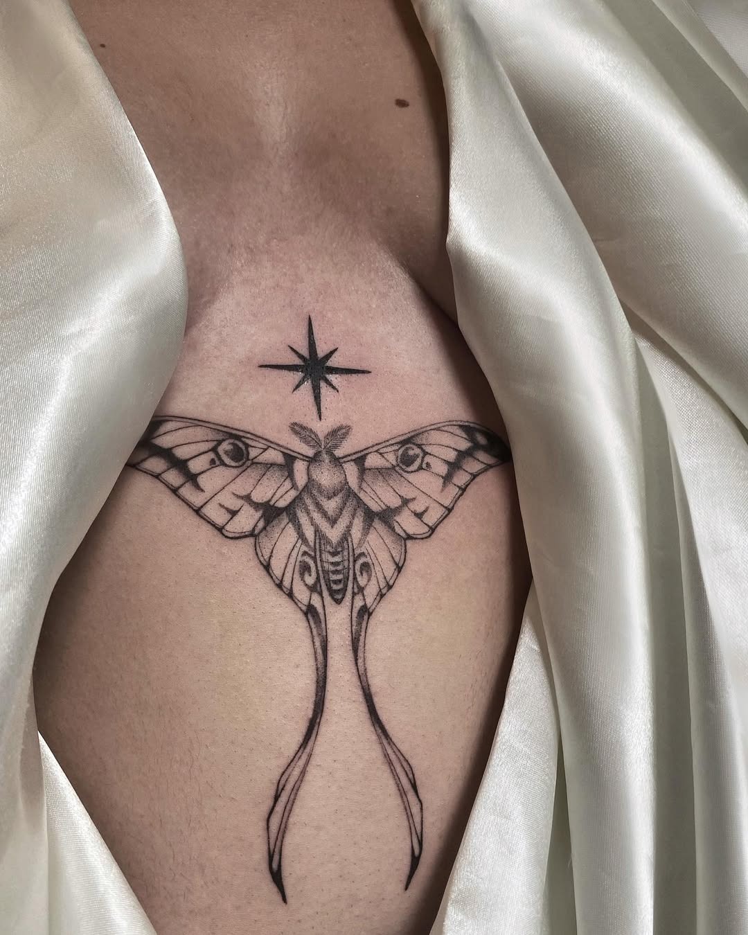 Elegant moth tattoo with celestial touch Tattoo Design