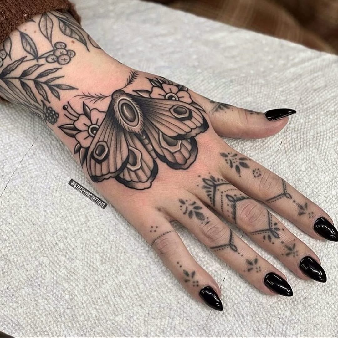Elegant moth tattoo with floral details Tattoo Design
