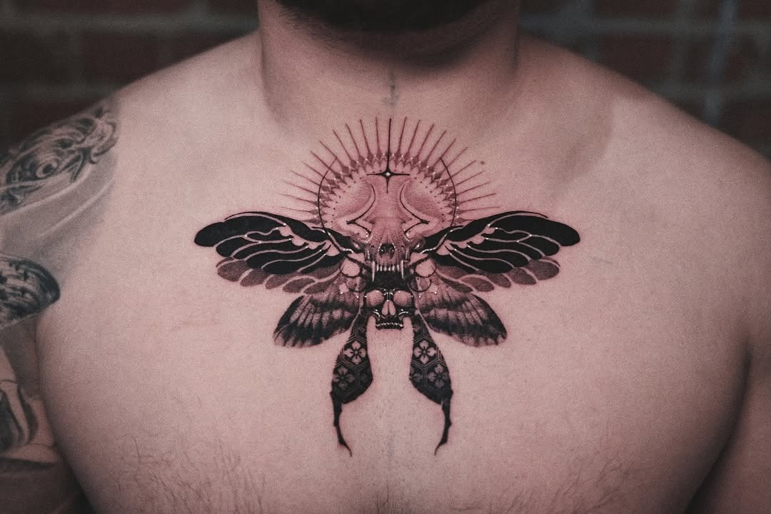 Intricate moth tattoo with celestial elements Tattoo Design