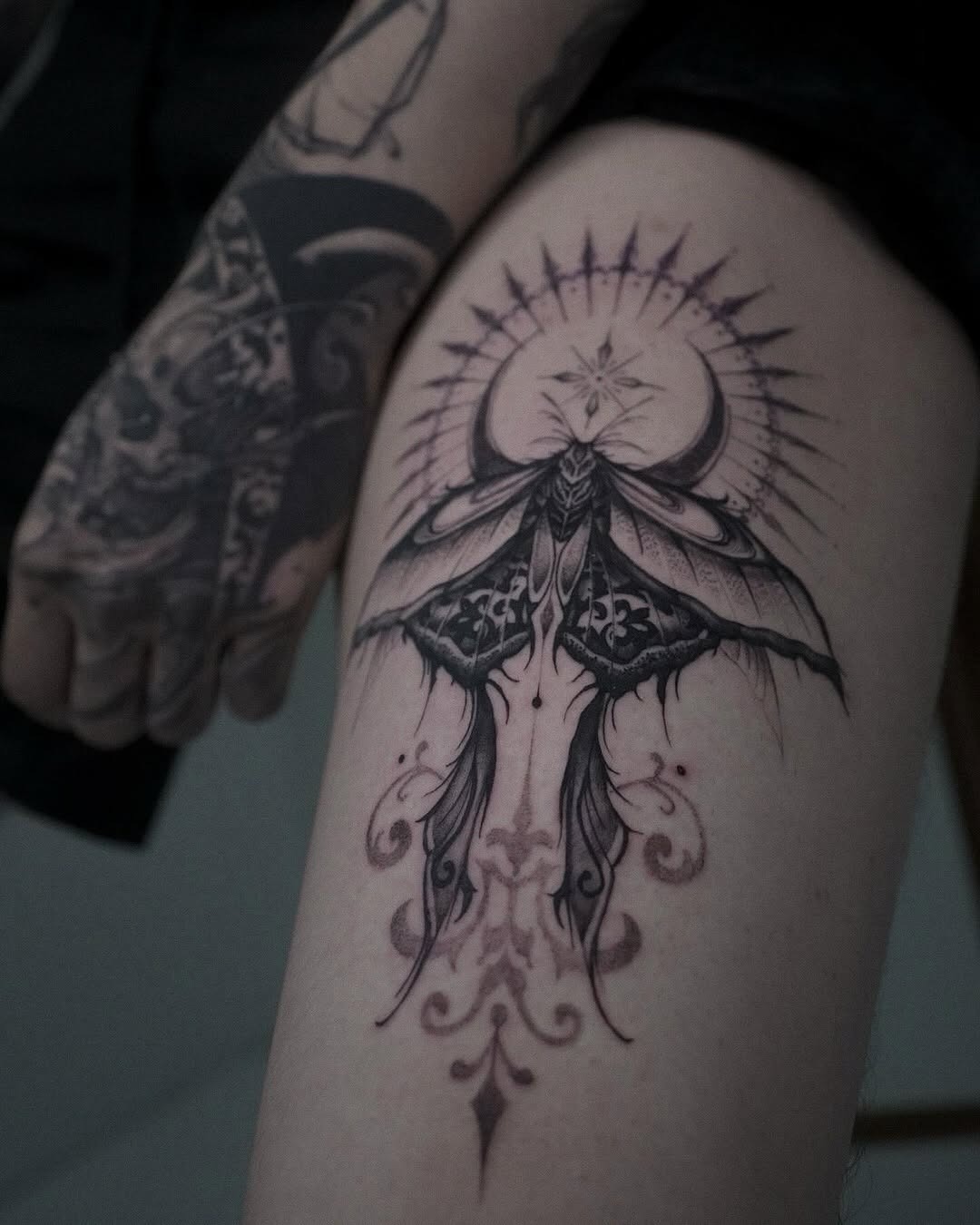 Intricate moth tattoo with celestial elements Tattoo Design