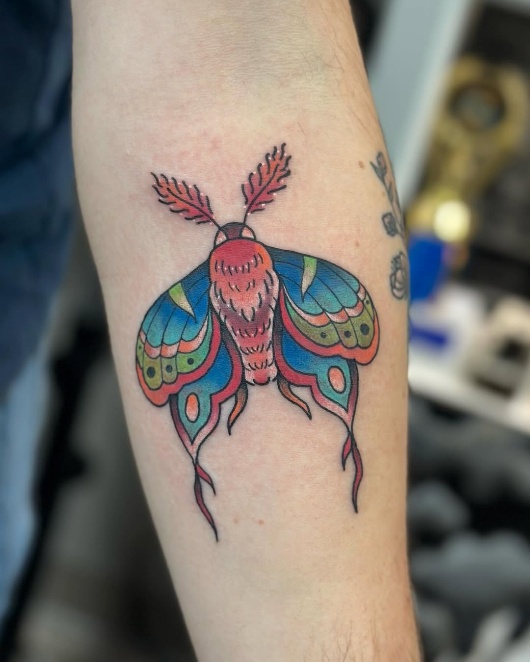 Stunning colorful moth tattoo with intricate details Tattoo Design