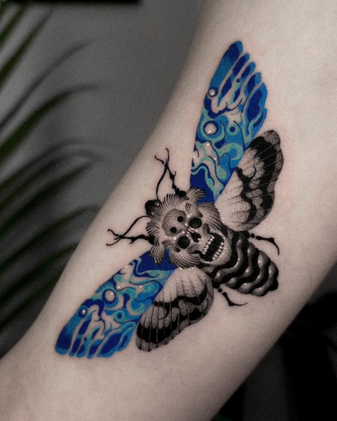 Stunning moth tattoo with black and blue hues Tattoo Design