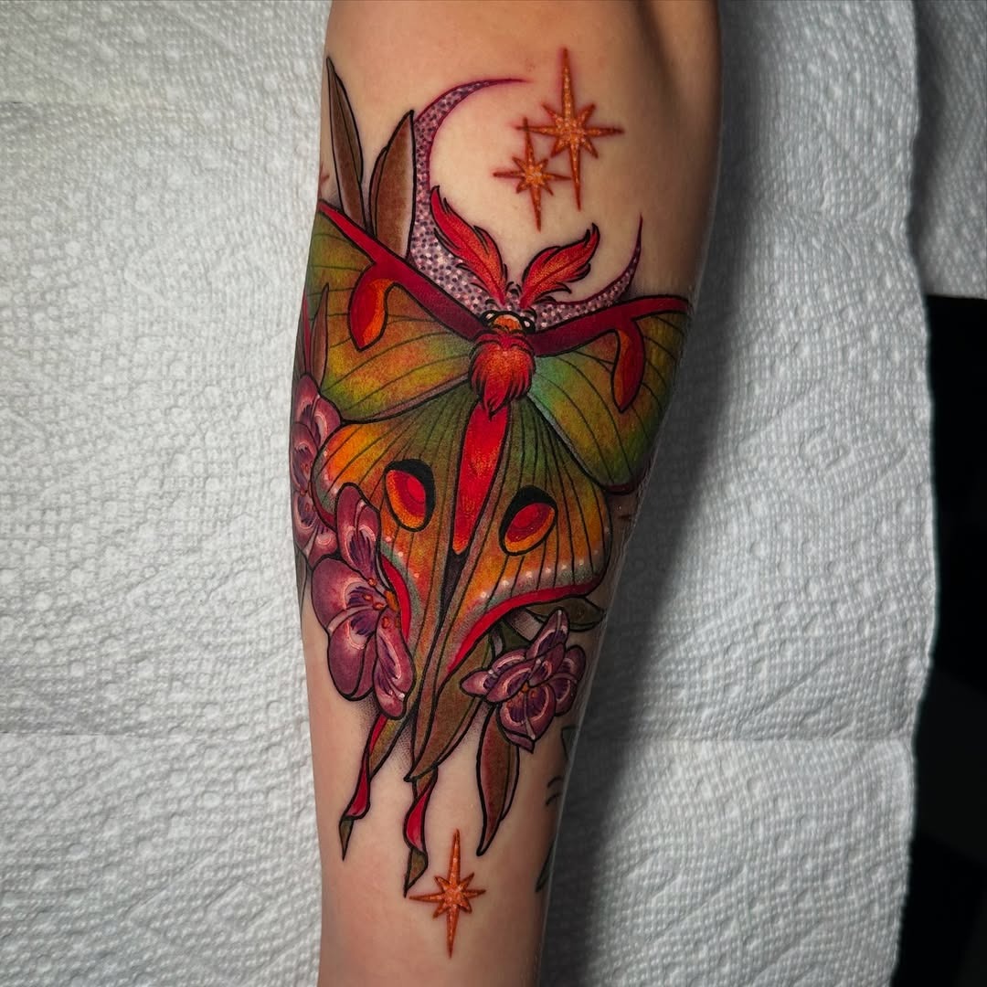Stunning moth tattoo with floral accents Tattoo Design