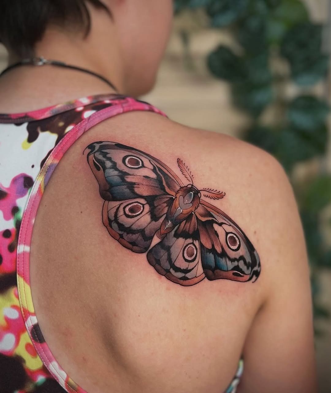 Stunning realistic moth tattoo on the back Tattoo Design
