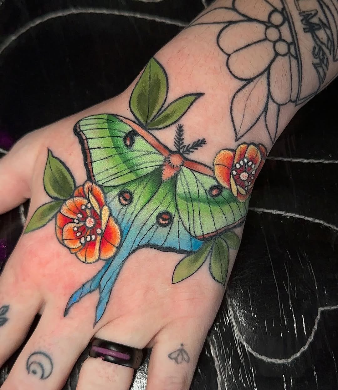 Vibrant moth tattoo with floral details Tattoo Design