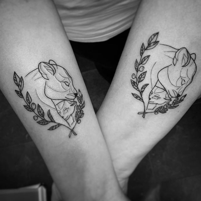 Asymmetrical Lioness & Cub Encircled by Laurels Tattoo Design