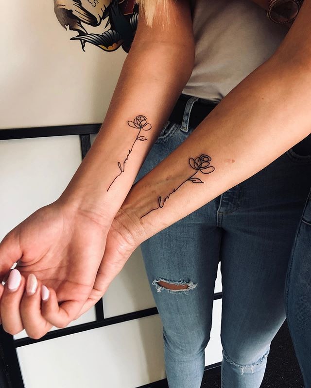 Minimalist “Love”-stemmed Rose Tattoo Tattoo Design