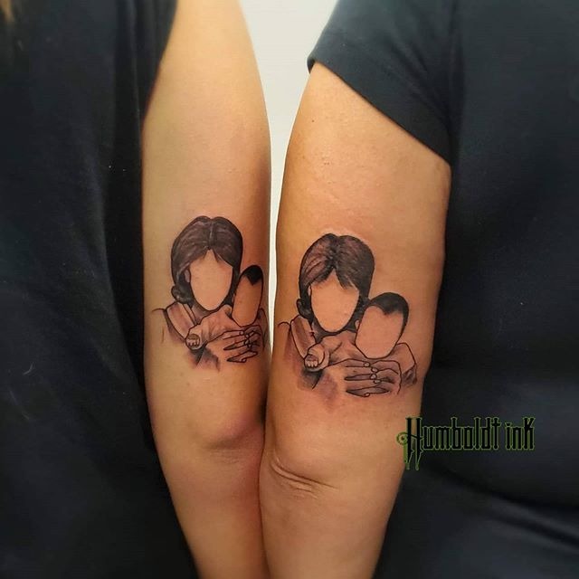 Mother Holding Child Above the Elbow Tattoo Tattoo Design