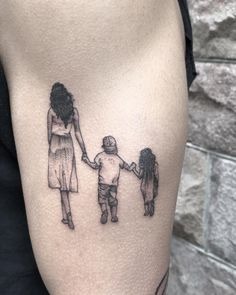 A Mother Cradling Her Sleeping Child Tattoo Design