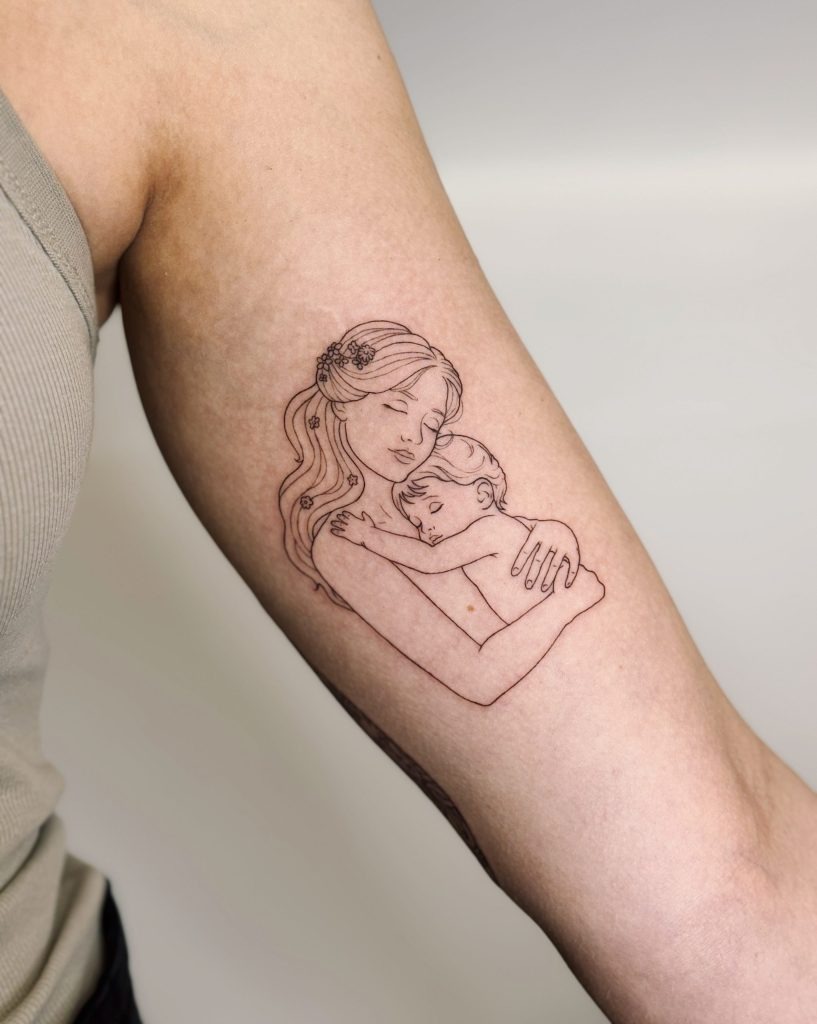 A Serene Moment: Mother Cradling Her Sleeping Child Tattoo Design