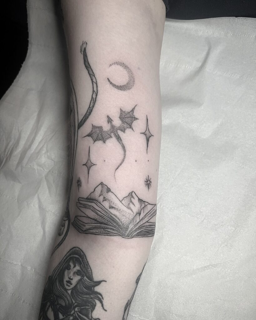 Enchanted Mountain and Dragon Book Tattoo Tattoo Design