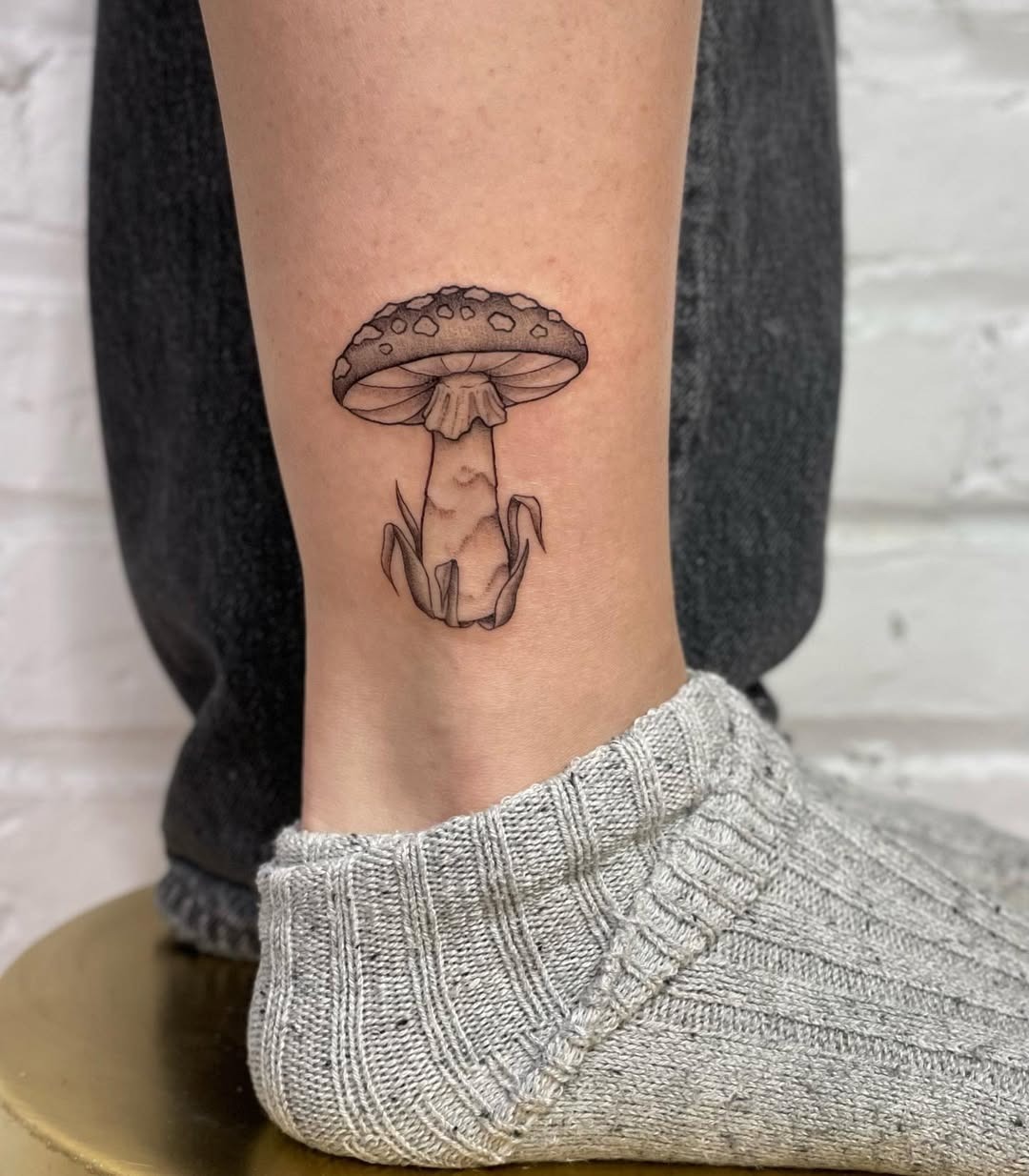 Charming mushroom tattoo gracing the ankle area Tattoo Design