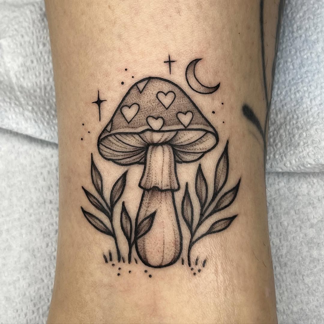 Charming mushroom tattoo with celestial elements Tattoo Design