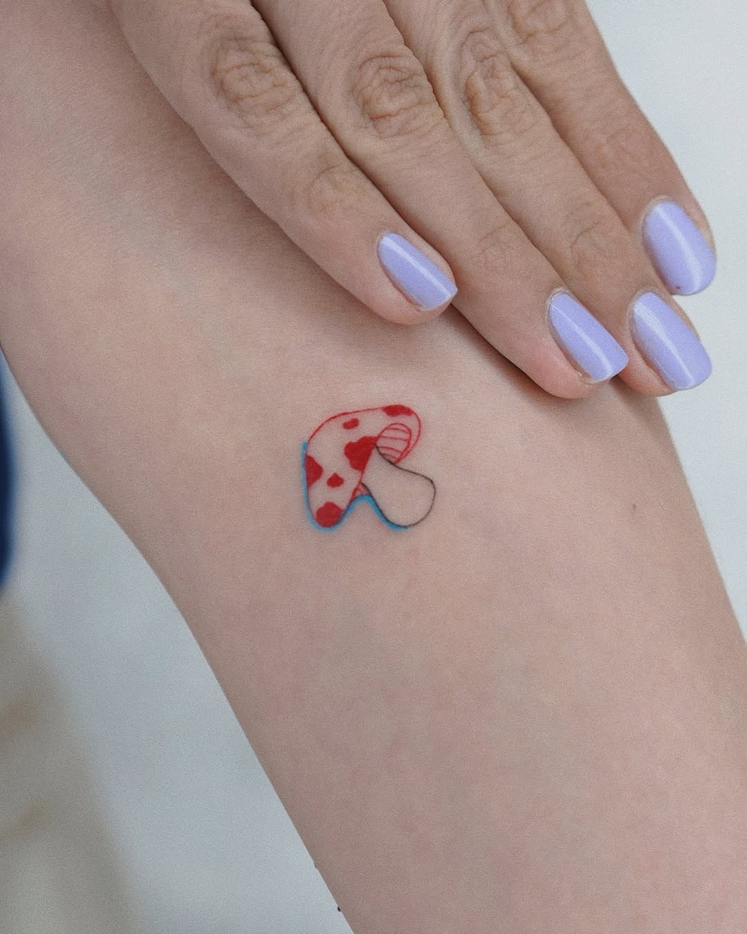 Colorful mushroom tattoo with a playful design Tattoo Design