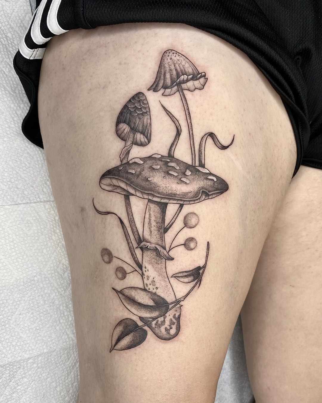Stunning thigh mushroom tattoo with delicate details Tattoo Design
