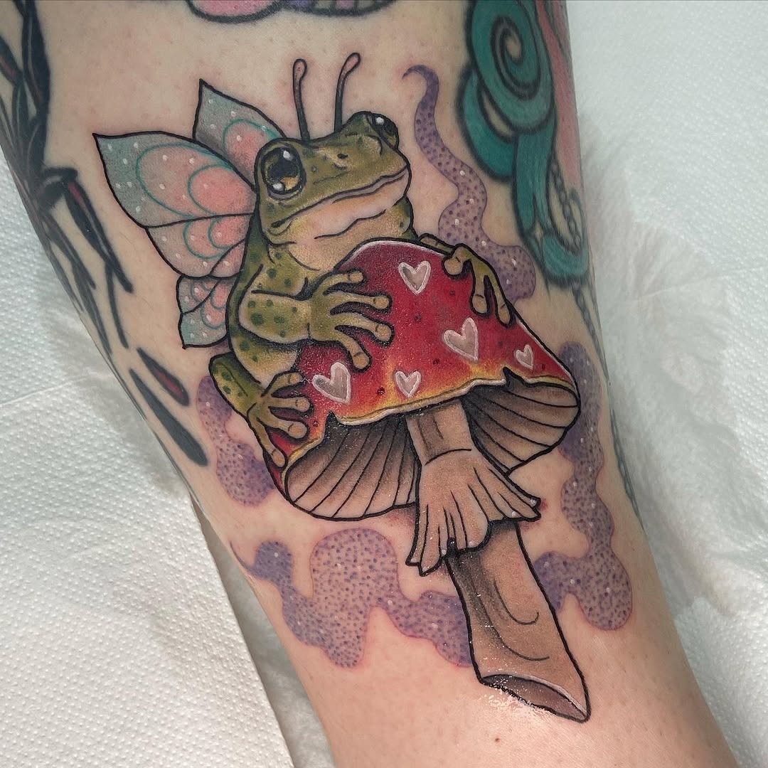 Whimsical frog on mushroom with fairy wings Tattoo Design