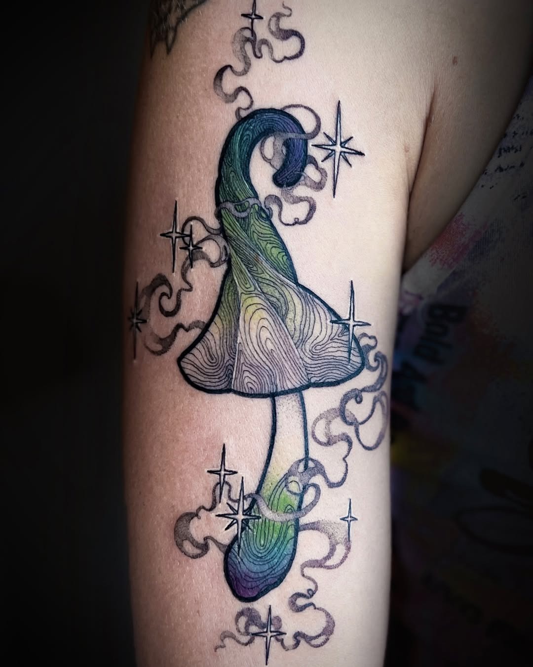 Whimsical mushroom tattoo with swirling colors Tattoo Design