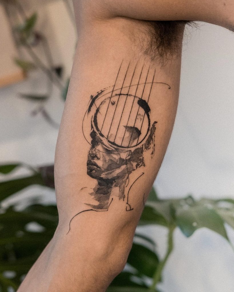 Headphone and Sheet Music Explosion Tattoo Tattoo Design