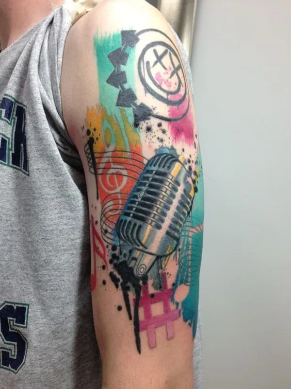 Microphone and Music Symbols Explosion Tattoo Design