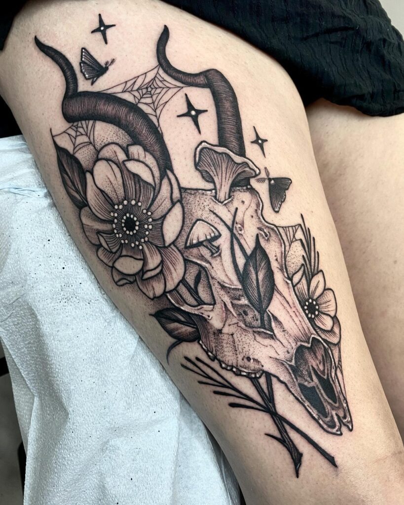 Goat Skull with Flowers and Moths Thigh Tattoo Tattoo Design