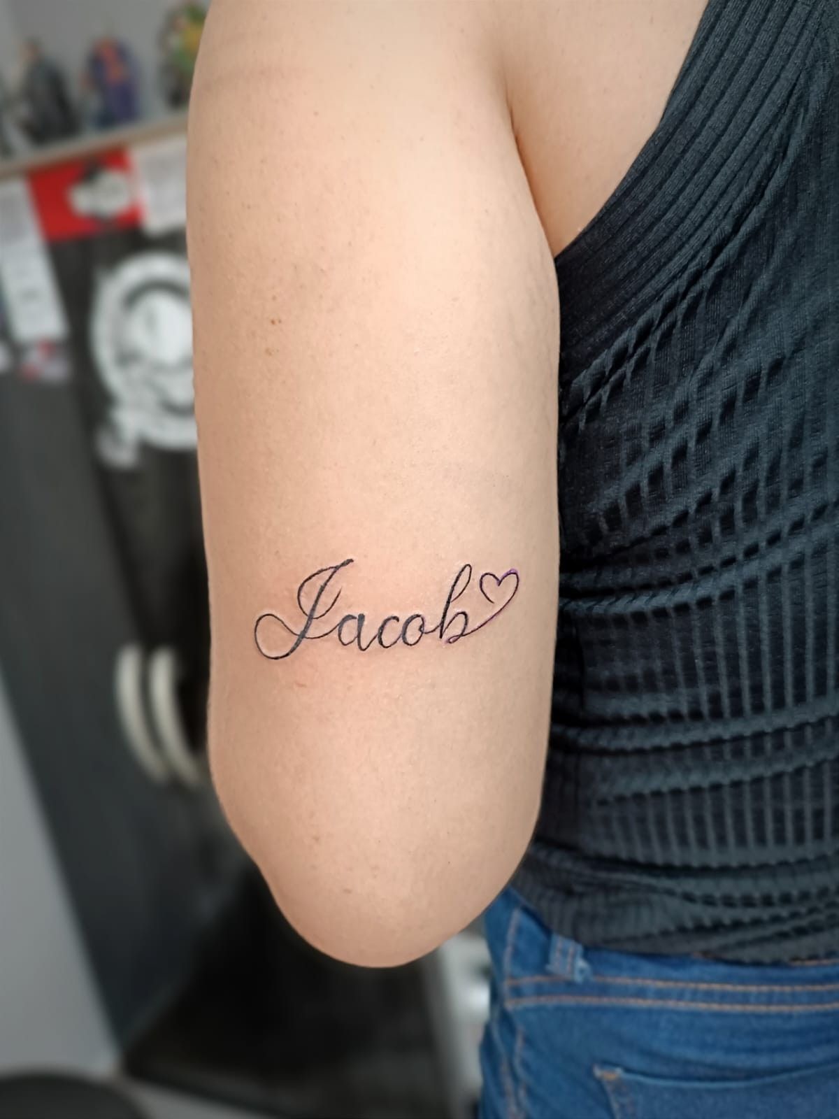 Jacob Cursive Tattoo With a Small Heart Tattoo Design