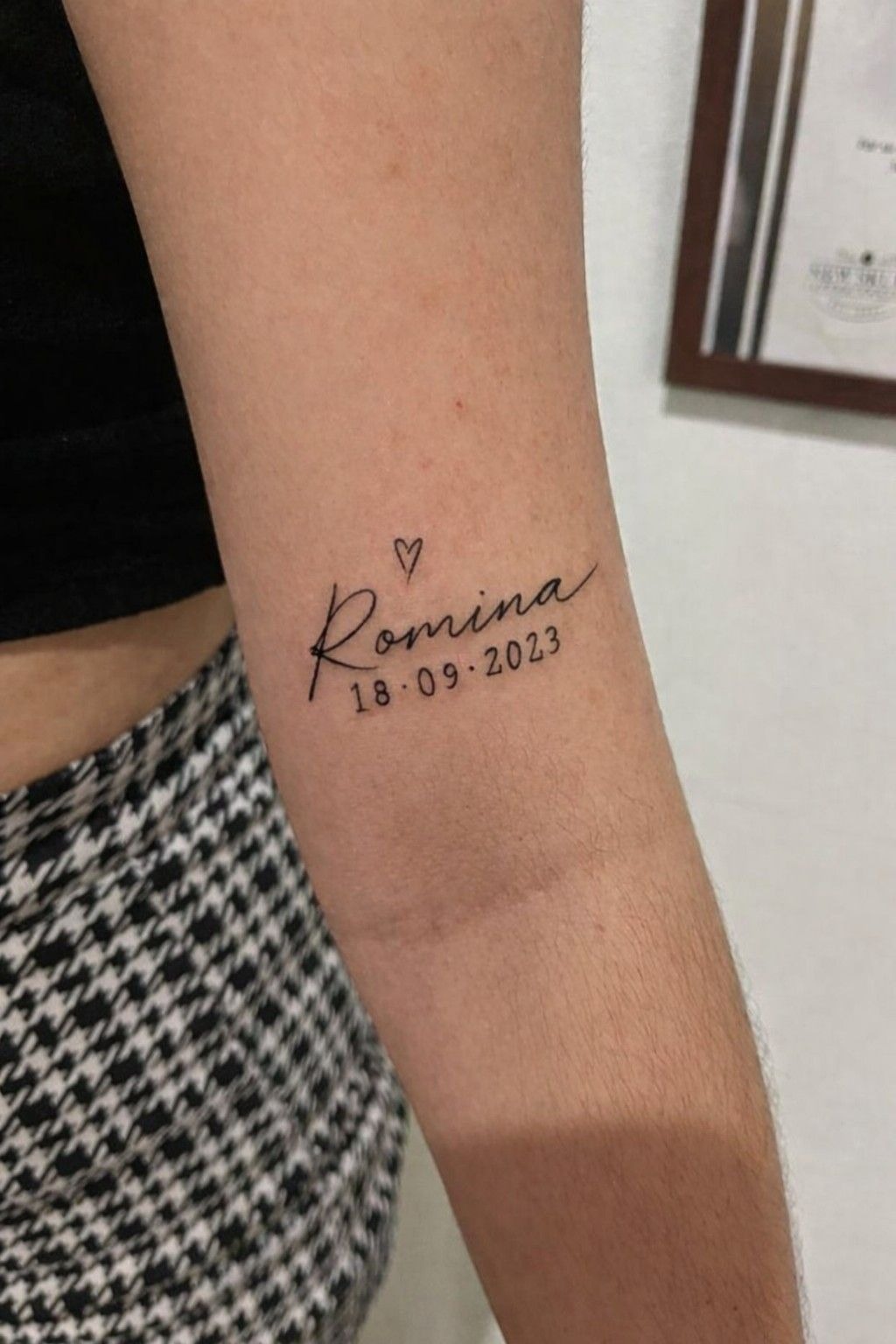 Romina Name Tattoo With Date and Tiny Heart Tattoo Design