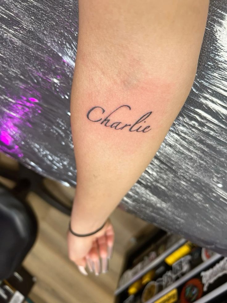 Simple Charlie Cursive Forearm Tattoo Tattoo Design