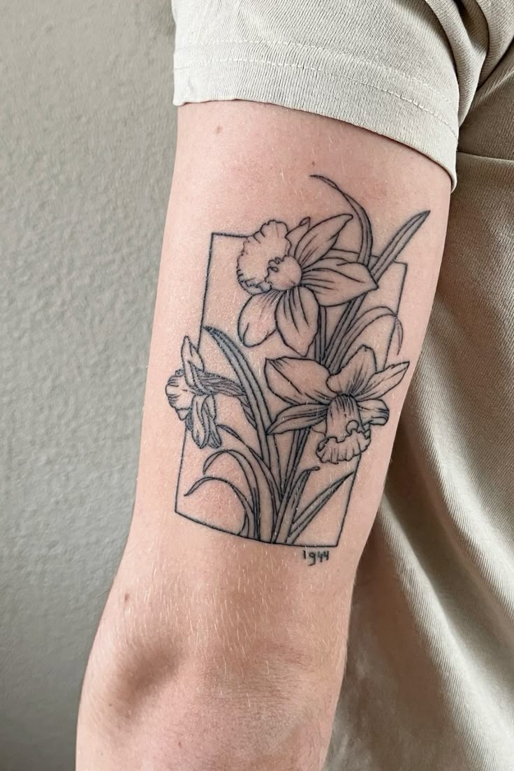 Soft-Shaded Narcissus Spray on the Upper Arm Tattoo Design
