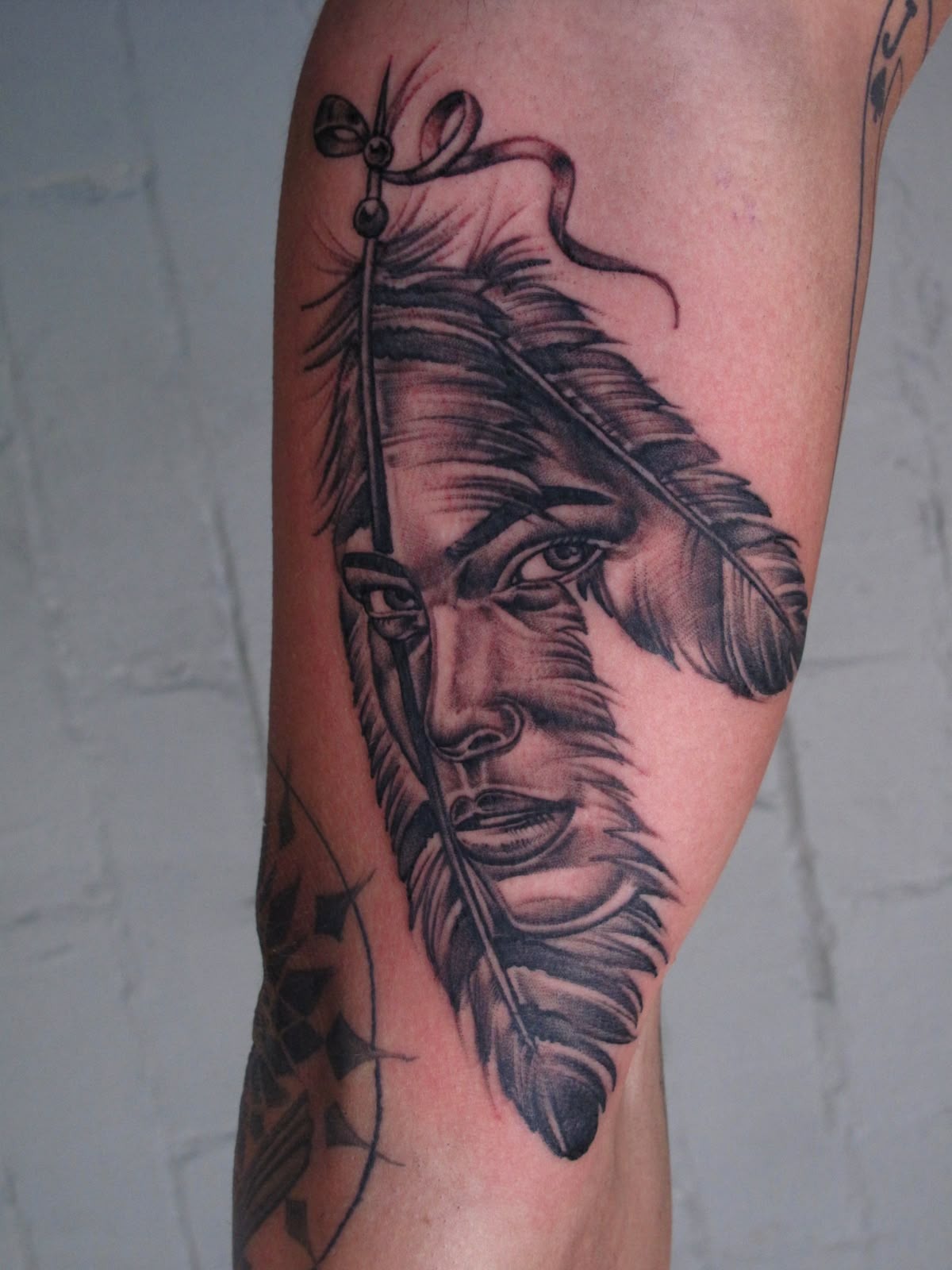 Feather and Face Realism Portrait Tattoo Design