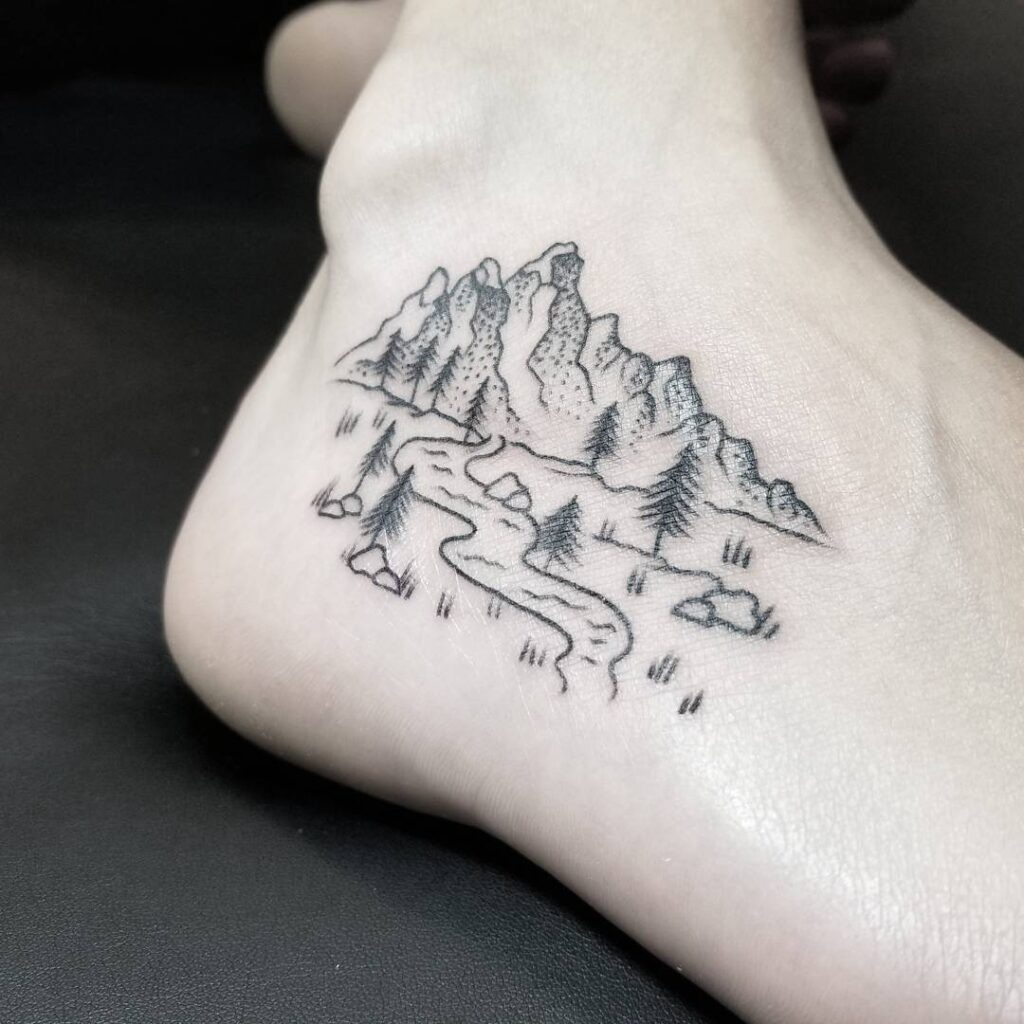 Minimal Mountain and River Tattoo on Foot Tattoo Design