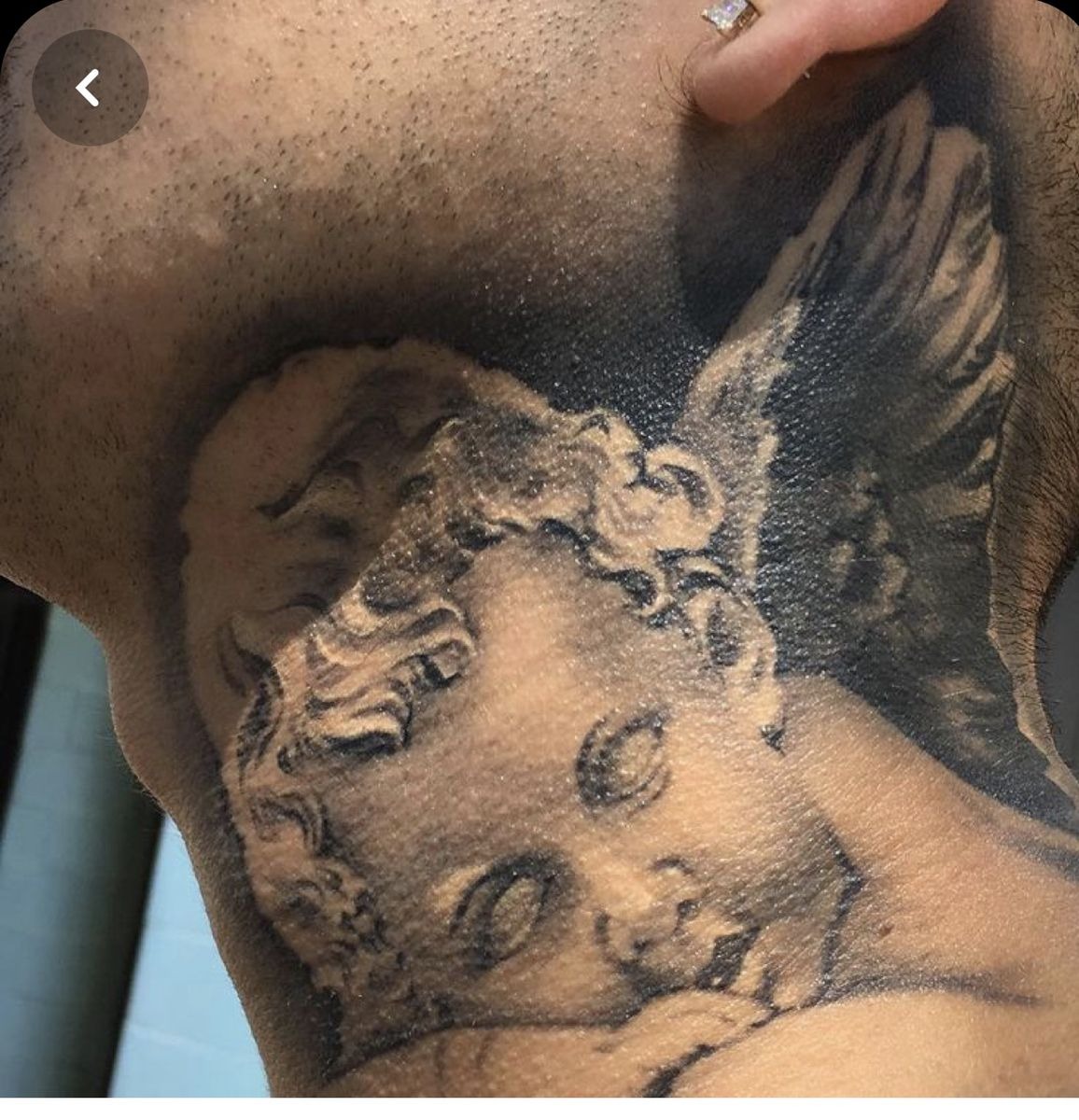 An Eerie Blank Eyed Angel Neck Tattoo Ideas Tattoo Design