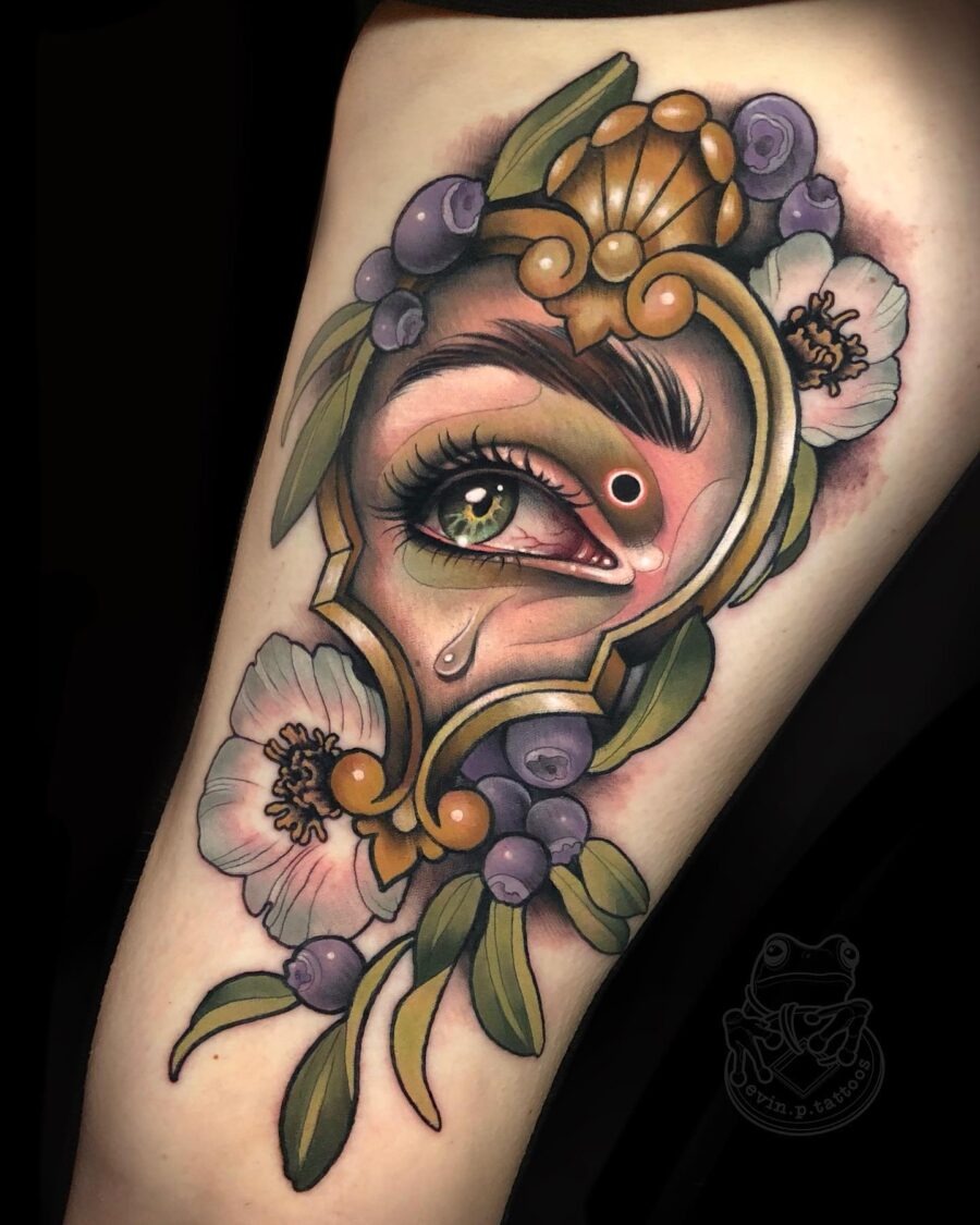 Intricate eye surrounded by floral elements. Tattoo Design